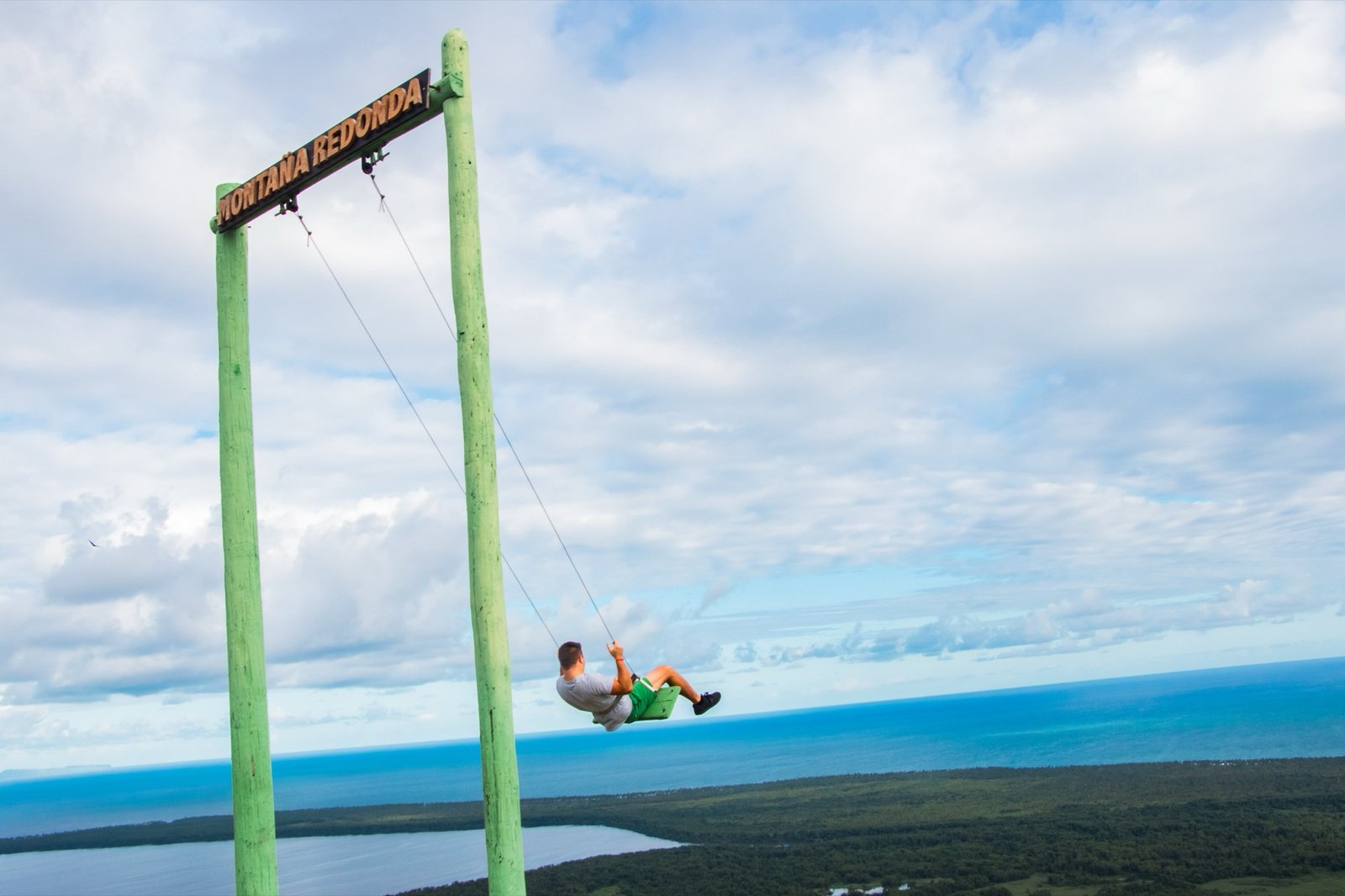 Visitor on the famous Montana Redonda swing overlooking the Miches countryside